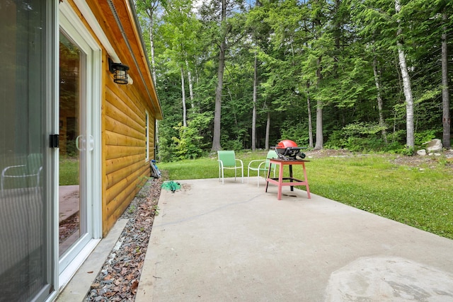 92 Cottage Shore Dr, Holden, ME 04429 - view of patio featuring a wooded view