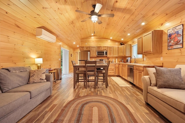 92 Cottage Shore Dr, Holden, ME 04429 - living area with a wall mounted air conditioner, wooden walls, lofted ceiling, light wood-style flooring, and plenty of natural light