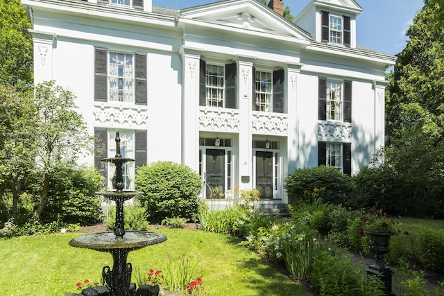 18 High St, Wiscasset, ME 04578 - greek revival inspired property with a front yard and a chimney