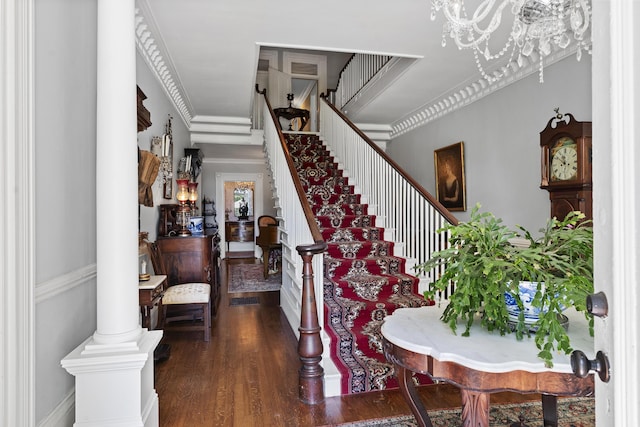 18 High St, Wiscasset, ME 04578 - entryway with wood finished floors, stairway, a chandelier, and ornamental molding