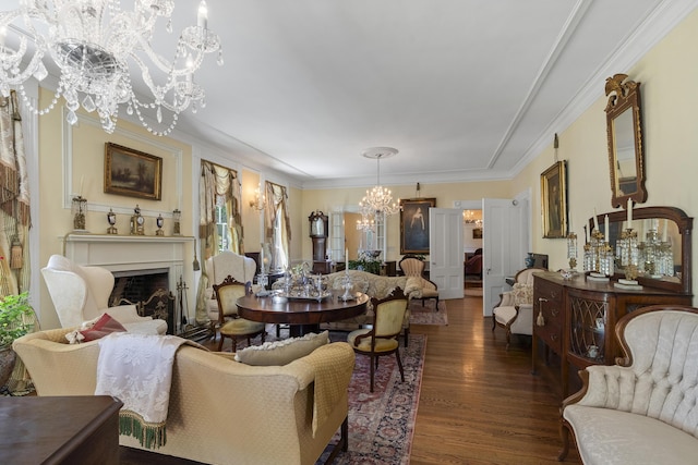 18 High St, Wiscasset, ME 04578 - living area featuring a chandelier, wood finished floors, a fireplace, and crown molding