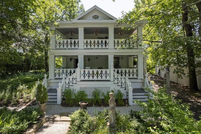 18 High St, Wiscasset, ME 04578 - view of front of home featuring a balcony, covered porch, and stairs