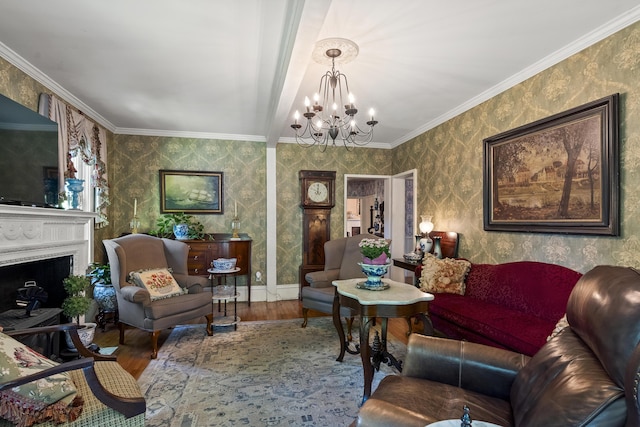 18 High St, Wiscasset, ME 04578 - living room featuring wood finished floors, a chandelier, wallpapered walls, ornamental molding, and a fireplace