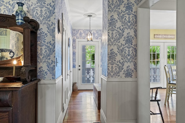18 High St, Wiscasset, ME 04578 - foyer featuring wallpapered walls, hardwood / wood-style flooring, and a wainscoted wall