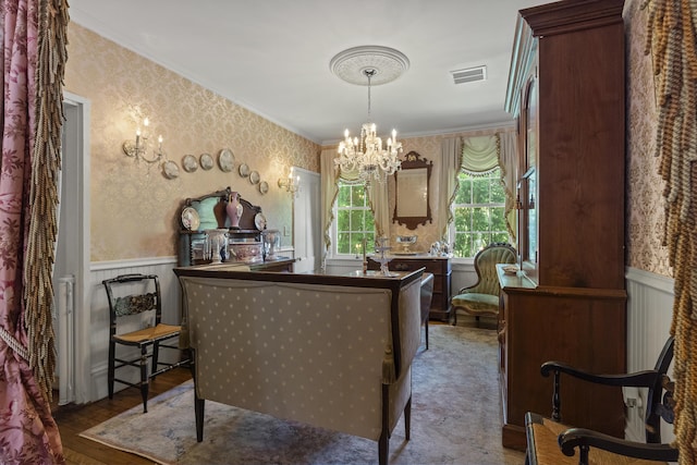 18 High St, Wiscasset, ME 04578 - sitting room featuring wallpapered walls, a chandelier, a wainscoted wall, wood-type flooring, and crown molding