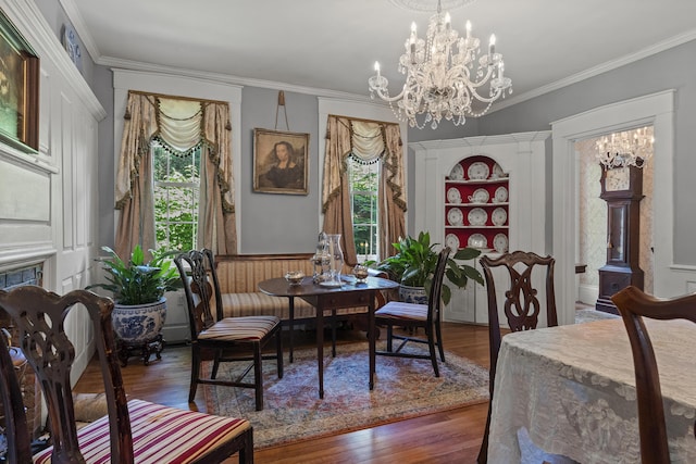 18 High St, Wiscasset, ME 04578 - dining area with wood finished floors, ornamental molding, a chandelier, and built in shelves