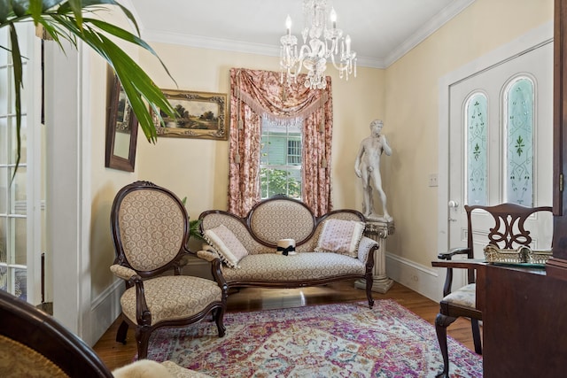 18 High St, Wiscasset, ME 04578 - sitting room with a chandelier, wood finished floors, and crown molding
