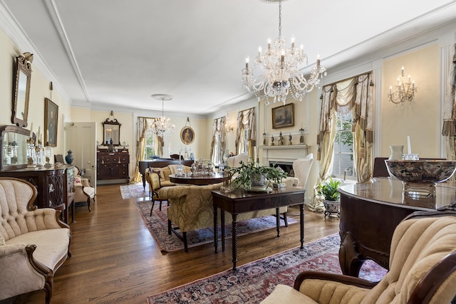 18 High St, Wiscasset, ME 04578 - living room with a chandelier, wood finished floors, crown molding, and a fireplace