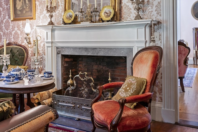 18 High St, Wiscasset, ME 04578 - detailed view of wallpapered walls, a high end fireplace, and wood finished floors