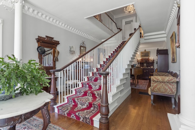 18 High St, Wiscasset, ME 04578 - stairway with wood finished floors and a chandelier