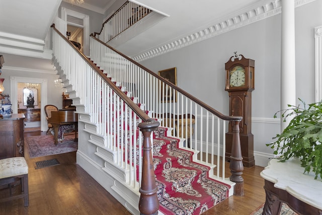 18 High St, Wiscasset, ME 04578 - stairs featuring wood finished floors and crown molding