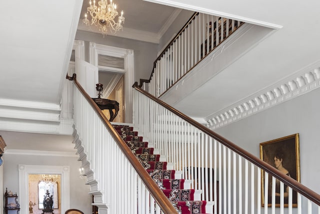 18 High St, Wiscasset, ME 04578 - stairs with a chandelier, crown molding, and a towering ceiling