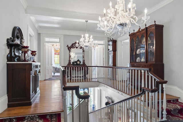 18 High St, Wiscasset, ME 04578 - hallway featuring a chandelier, an upstairs landing, crown molding, and wood finished floors