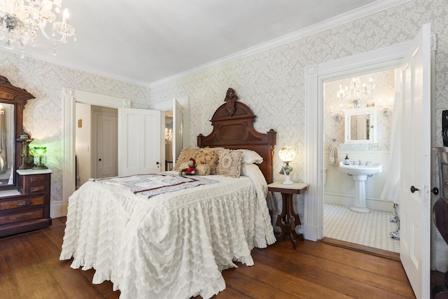 18 High St, Wiscasset, ME 04578 - bedroom with wallpapered walls, wood-type flooring, a chandelier, crown molding, and ensuite bathroom