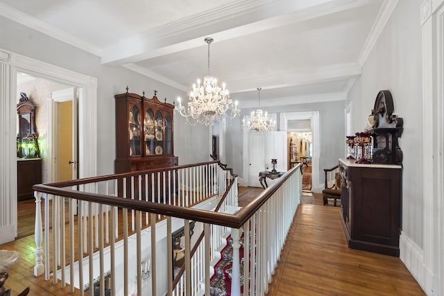 18 High St, Wiscasset, ME 04578 - corridor featuring beam ceiling, wood-type flooring, an upstairs landing, a chandelier, and crown molding