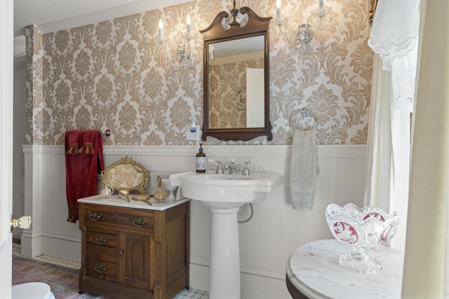 18 High St, Wiscasset, ME 04578 - bathroom featuring wallpapered walls and a wainscoted wall