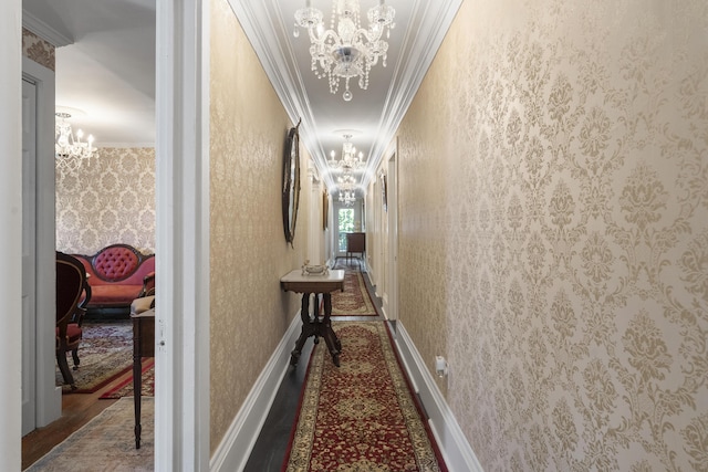18 High St, Wiscasset, ME 04578 - hallway with a chandelier, crown molding, and wallpapered walls