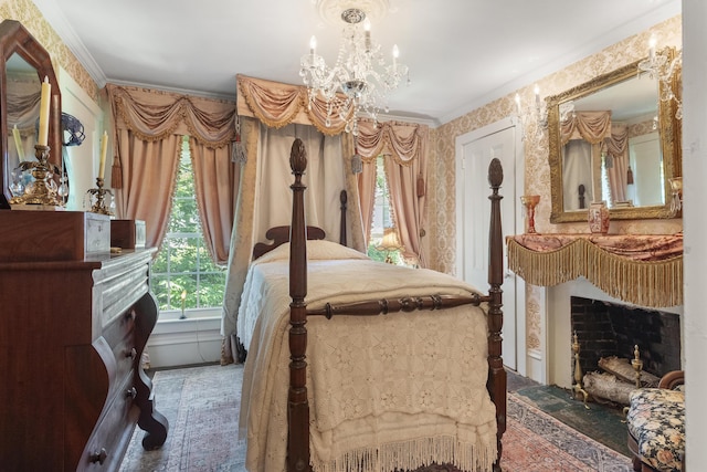 18 High St, Wiscasset, ME 04578 - bedroom with a fireplace, wallpapered walls, crown molding, and a chandelier