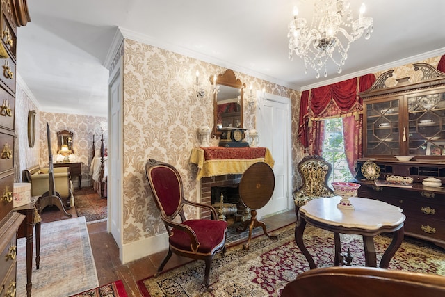 18 High St, Wiscasset, ME 04578 - living area with wallpapered walls, ornamental molding, wood finished floors, and a chandelier