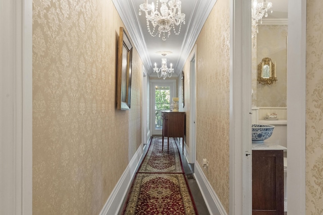 18 High St, Wiscasset, ME 04578 - hallway with crown molding, a chandelier, and wallpapered walls