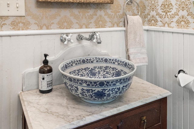 18 High St, Wiscasset, ME 04578 - bathroom view of wallpapered walls and a wainscoted wall