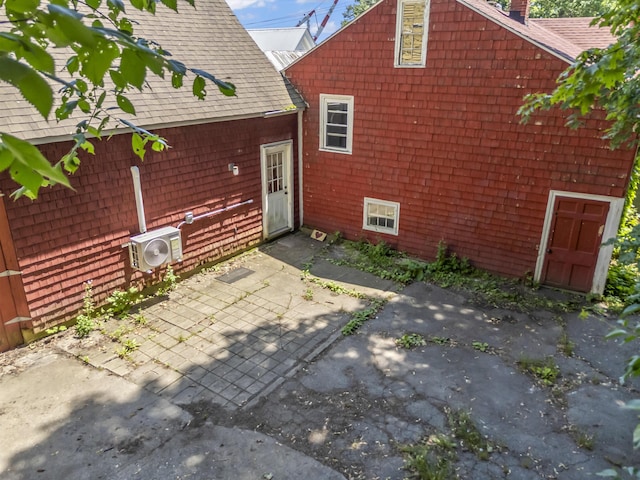 141 Centre St, Bath, ME 04530 - rear view of house with a patio area, a shingled roof, and a chimney
