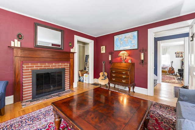 141 Centre St, Bath, ME 04530 - living area with wood finished floors, a fireplace, and crown molding
