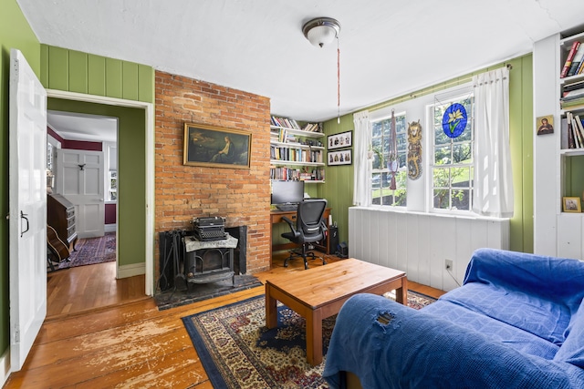 141 Centre St, Bath, ME 04530 - living area featuring hardwood / wood-style floors, a wood stove, and built in shelves