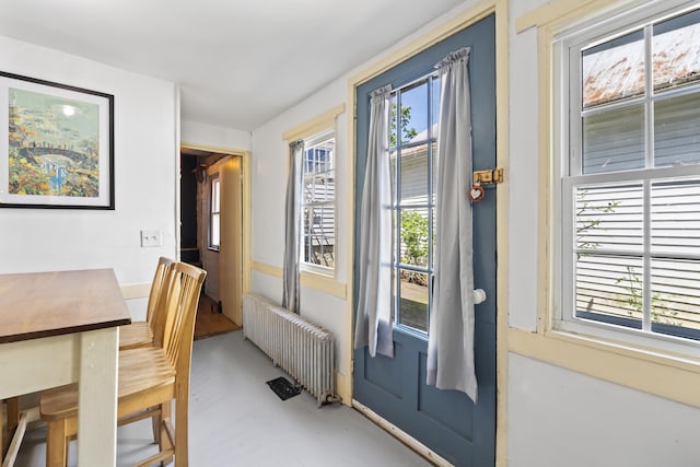 141 Centre St, Bath, ME 04530 - doorway to outside with radiator and finished concrete flooring