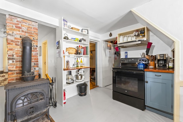 141 Centre St, Bath, ME 04530 - kitchen featuring black electric range oven, open shelves, under cabinet range hood, and a wood stove
