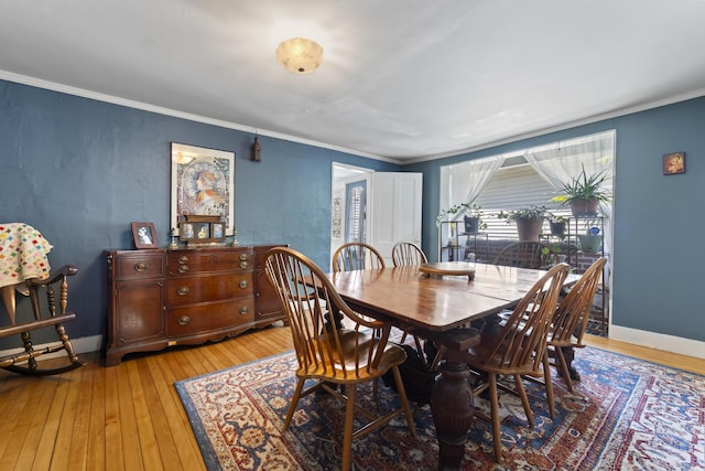 141 Centre St, Bath, ME 04530 - dining room featuring light wood-style floors and crown molding