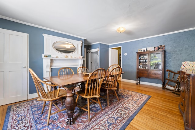 141 Centre St, Bath, ME 04530 - dining area featuring light wood-style floors and ornamental molding