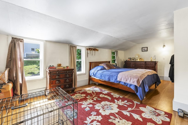 141 Centre St, Bath, ME 04530 - bedroom featuring multiple windows, lofted ceiling, and wood finished floors