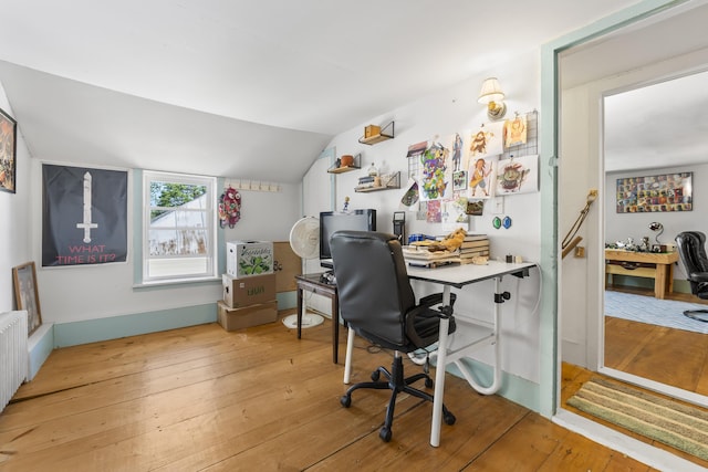 141 Centre St, Bath, ME 04530 - office area featuring light wood finished floors, vaulted ceiling, and radiator