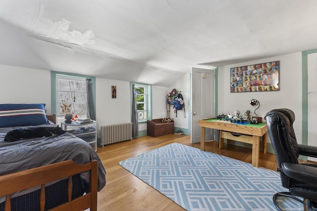 141 Centre St, Bath, ME 04530 - bedroom featuring radiator heating unit, wood finished floors, and vaulted ceiling