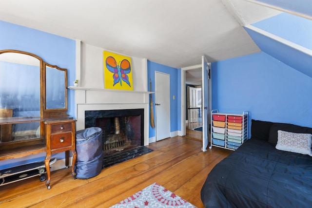 141 Centre St, Bath, ME 04530 - bedroom featuring hardwood / wood-style floors and a fireplace with flush hearth