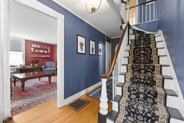 141 Centre St, Bath, ME 04530 - staircase with wood finished floors and crown molding
