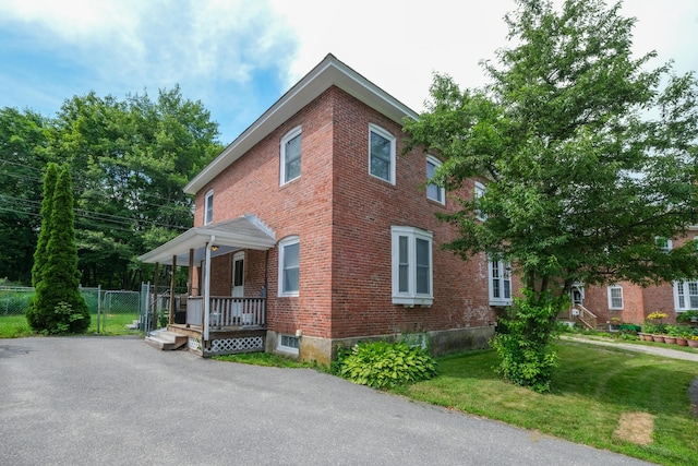 25 Oliver St, Bath, ME 04530 - view of side of home featuring brick siding