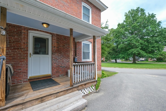 25 Oliver St, Bath, ME 04530 - entrance to property with covered porch and brick siding