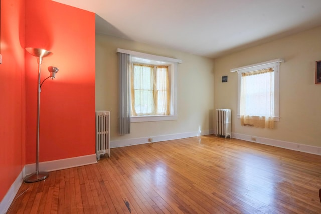 25 Oliver St, Bath, ME 04530 - unfurnished room featuring radiator heating unit and hardwood / wood-style floors