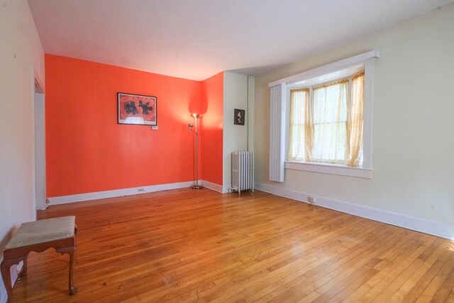 25 Oliver St, Bath, ME 04530 - spare room featuring radiator and light wood finished floors