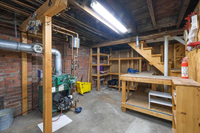25 Oliver St, Bath, ME 04530 - unfinished below grade area featuring a heating unit and stairway