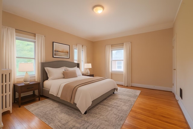 25 Oliver St, Bath, ME 04530 - bedroom with light wood-style floors and multiple windows