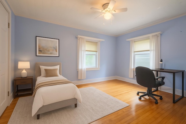 25 Oliver St, Bath, ME 04530 - bedroom featuring light wood-style floors, ornamental molding, a ceiling fan, and a desk