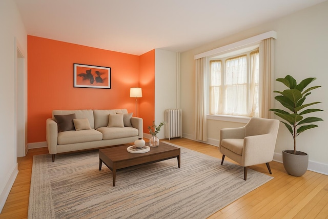 25 Oliver St, Bath, ME 04530 - living area with radiator heating unit and wood finished floors
