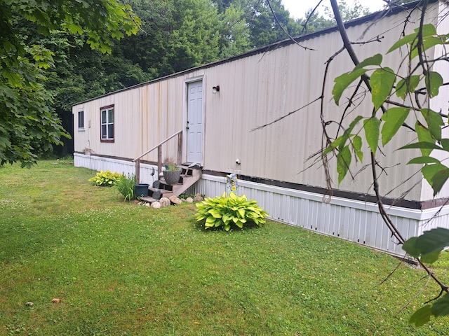 26-28 Addison St, Lisbon, ME 04252 - view of side of home with entry steps and a yard
