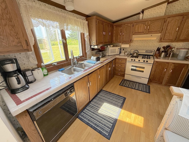 8 Bar Is, Tremont, ME 04674 - kitchen featuring white appliances, under cabinet range hood, light wood-type flooring, lofted ceiling, and wallpapered walls