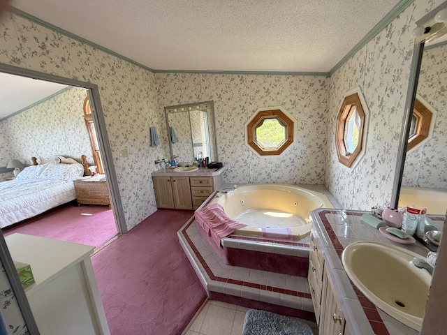 8 Bar Is, Tremont, ME 04674 - bathroom featuring ensuite bathroom, crown molding, two vanities, a jetted tub, and a textured ceiling