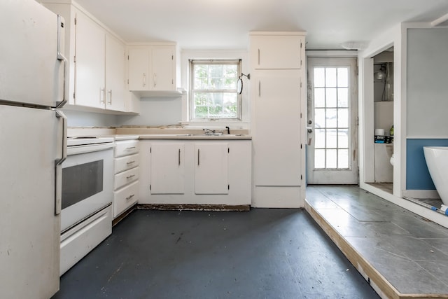 20 Elmwood Ave, Westbrook, ME 04092 - kitchen with white appliances, white cabinetry, concrete flooring, and light countertops