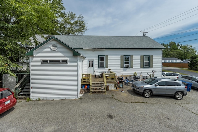 20 Elmwood Ave, Westbrook, ME 04092 - view of front of home featuring a shingled roof, a wooden deck, and stairs